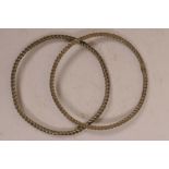 A pair of white metal rope twist bangles, 3¾" diameter