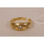 An 18ct gold gypsy ring set with three old cut diamonds, size R, gross 4.3g
