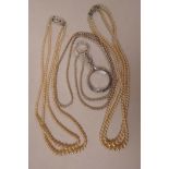 A two strand pearl necklace with silver and marcasite clasp, 18" long, together with a two strand