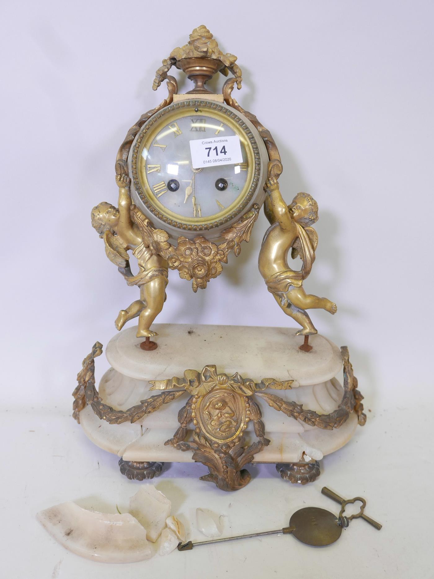 A French C19th alabaster and brass mounted mantel clock, the movement stamped Hy Marc. Paris, and