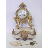 A French C19th alabaster and brass mounted mantel clock, the movement stamped Hy Marc. Paris, and
