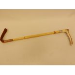 A horn handled bamboo riding crop with hallmarked silver ferule, 24" long