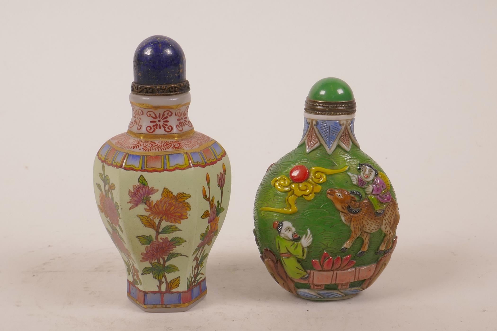 A Chinese enamelled glass snuff bottle decorated with flowers, together with another glass snuff
