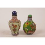 A Chinese enamelled glass snuff bottle decorated with flowers, together with another glass snuff