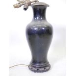 A C19th Chinese famille noir ceramic vase, six character mark to base, drilled and converted to a