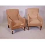 A pair of Edwardian bedroom armchairs, raised on square tapering supports, 30" high