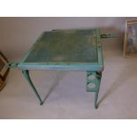 A folding bridge table with chinoiserie decoration, cabriole legs and cup holders, and inset