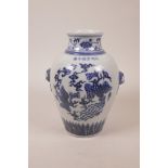 A Chinese blue and white porcelain vase with dove mask handles, decorated with two phoenix in