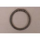 A white metal rope twist bangle with lion head ends, 2½" diameter