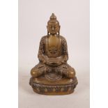 A bronzed metal figure of Buddha, possibly Burmese, 8" high