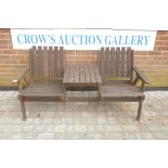 A two seat teak garden bench, 61" wide, 32" high