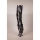 A black stone fossil sculpture, some losses, 24" high