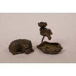 A Chinese bronzed metal incense holder in the form of a lotus flower and pad, together with a