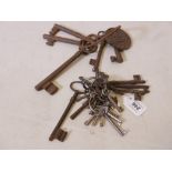 A quantity of antique keys, largest 6" long