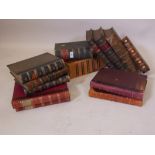 A quantity of antique leather bound books