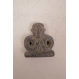 A Tibetan hardstone pendant of a stylised Buddha, 2½"
