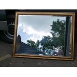 A gilt framed bevelled glass wall mirror, 40" x 30"