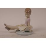 A Lladro porcelain figurine 'Rosy Posey', number 6690, 5" high