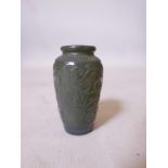 A Chinese jade vase with carved scrolling lotus flower decoration, 4" high