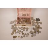 A collection of world coins including USA Kennedy half dollar, Australian Penny etc in a vintage