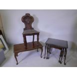 A Victorian mahogany hall chair with carved back, together with a mahogany coffee table and matching