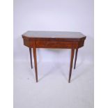 A C19th mahogany tea table with fold over top, raised on square tapering supports, 36" x 18" x 29"