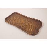 A Chinese hardwood tray with carved bamboo and kylin decoration, 6½" x 13"