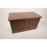 A small mahogany box in the form of a dower chest, the base drawer with bone inlaid escuctheons,