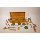 'The International Table Croquet Set' by F.H. Ayres Ltd of London, cased, lacks balls, 14½" x 5½"