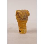A carved bone walking stick handle in the form of a clenched fist, 3½"