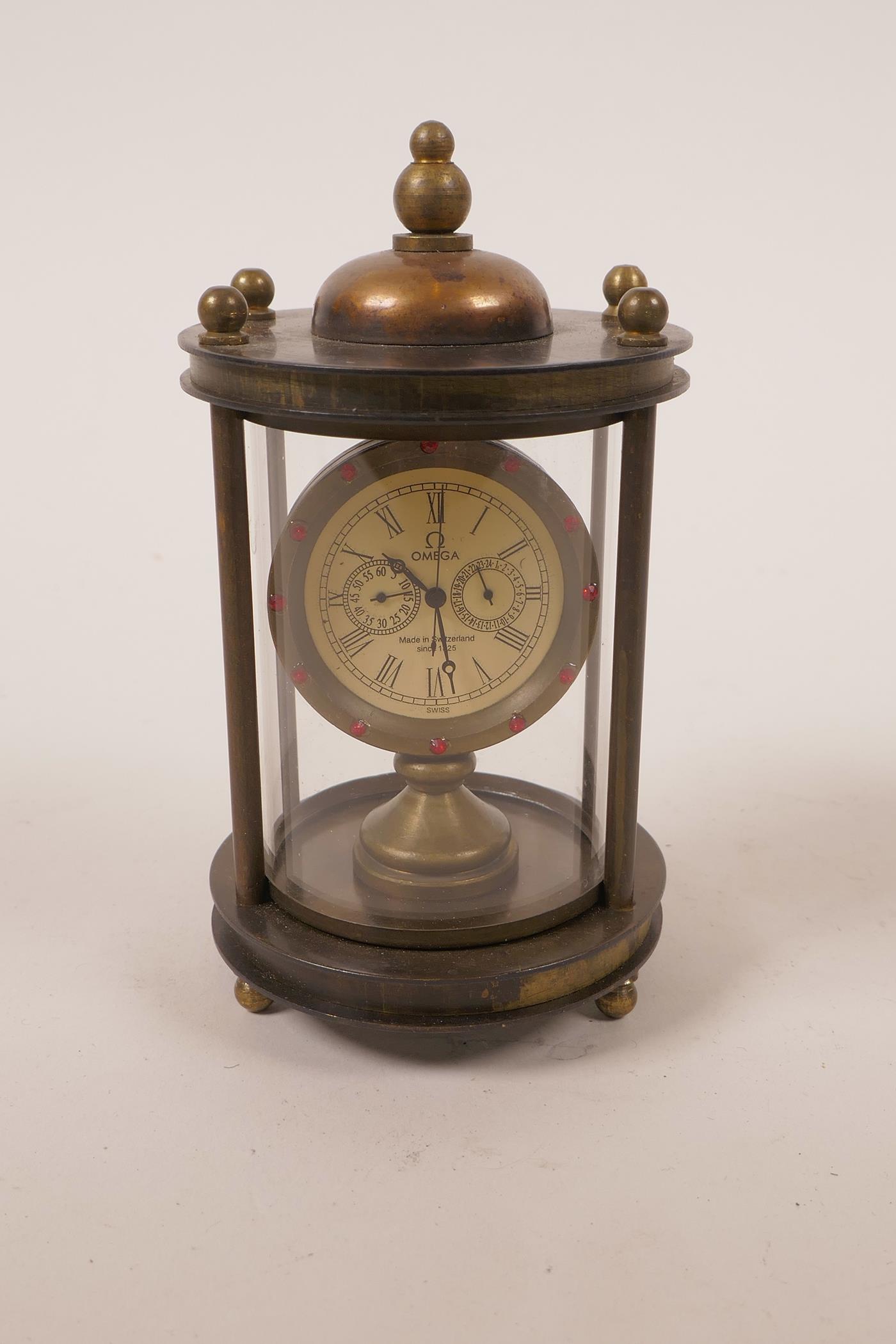A bronze metal cased desk clock with an open movement, 4½" high