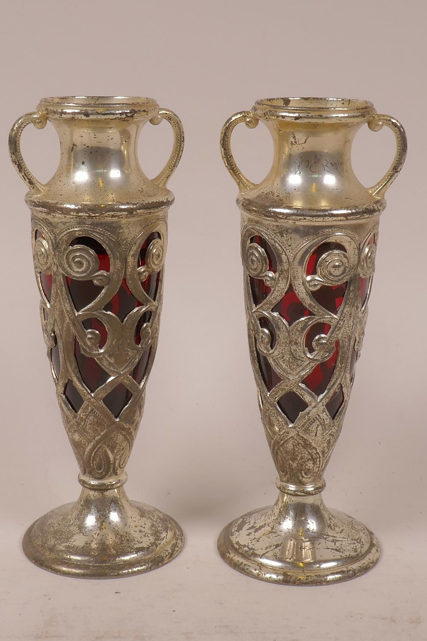 A pair of Japanese pierced plated antimony specimen vases with cranberry glass lines, 7" high
