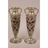 A pair of Japanese pierced plated antimony specimen vases with cranberry glass lines, 7" high