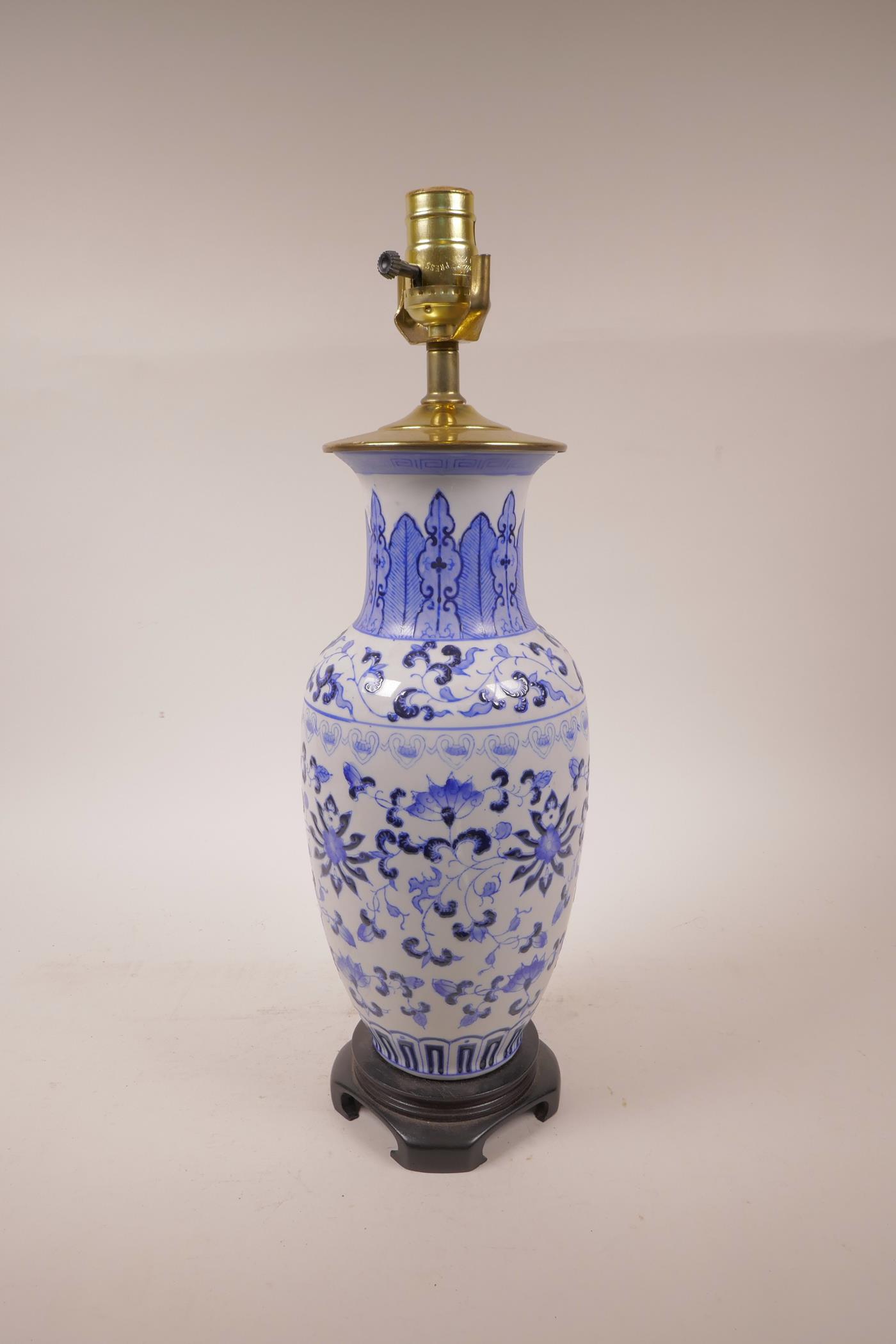 A Chinese blue and white porcelain vase with scrolling lotus flower decoration, converted to a lamp, - Image 2 of 2