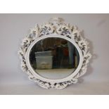 A carved and painted wood framed wall mirror with bevelled glass plate, 44" x 44"