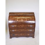 A Continental inlaid walnut cylinder topped writing bureau with pull out slide inset with leather,