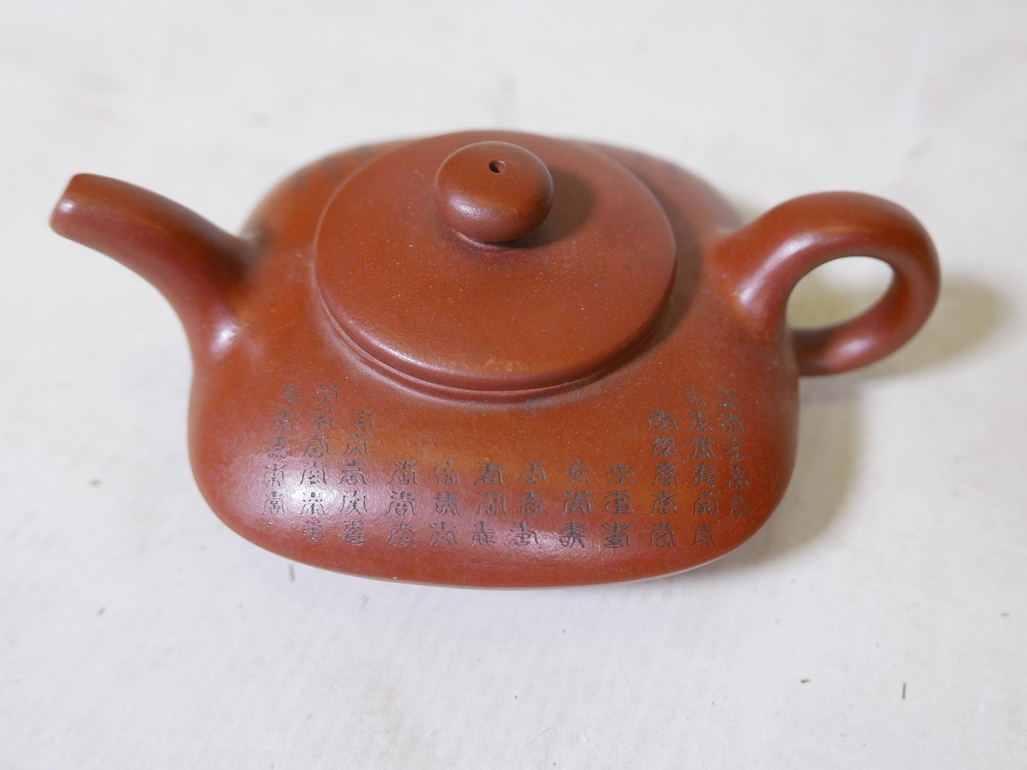 A Chinese square form YiXing teapot, decorated with character inscriptions to side, impressed seal - Image 3 of 4