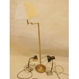 A brass column floor lamp, 53" high, and two contemporary anglepoise desk lamps