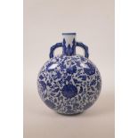 A Chinese blue and white porcelain two handled moon flask with scrolling floral decoration, seal
