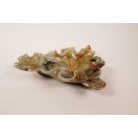 A Chinese carved soapstone bowl in the form of a lotus flower and lily pad, faults, 10" x 8"