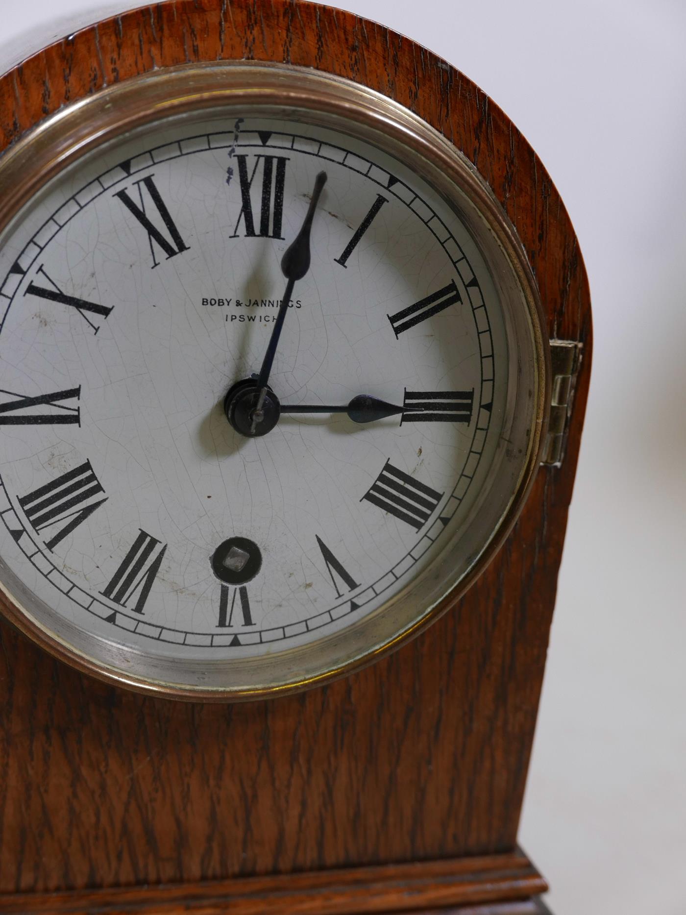 An oak cased dome top mantel clock by Bobby & Jennings of Ipswich, with silvered dial and Roman - Image 2 of 3