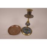 A C19th French champleve enamel candlestick, 8" high, together with a French embossed copper ashtray
