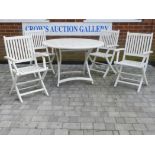 A white painted Scancom teak garden table and four chairs, 43" diameter