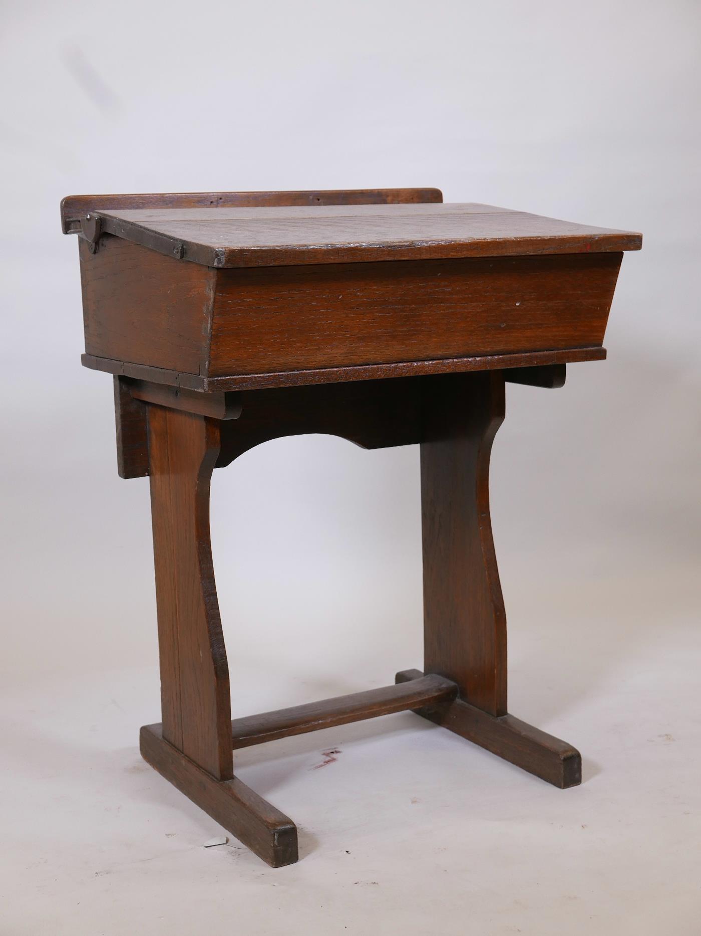 An early C20th oak school desk, 24" x 19" x 32" high