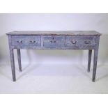 A Georgian pine three drawer dresser base, retaining the original blue/green painted finish, and