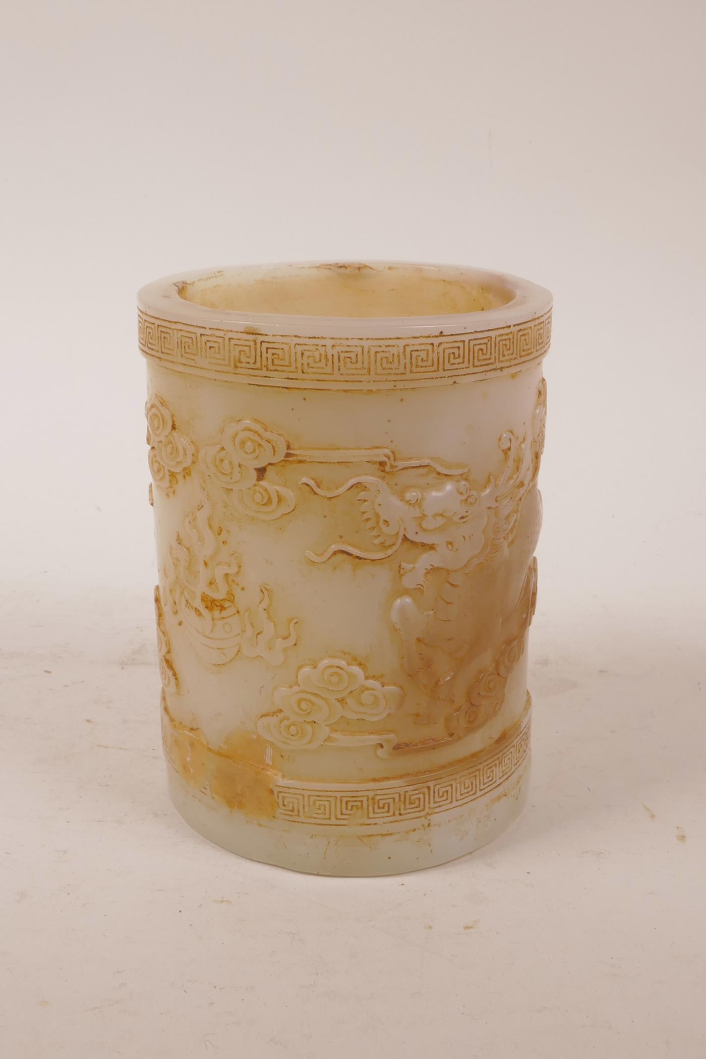 A Chinese moulded glass brush pot with raised decoration of kylin and the flaming pearl, 5" high x - Image 2 of 5