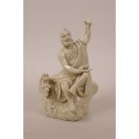 A Chinese blanc de chine porcelain Lohan seated on a rock with a dragon, impressed marks, A/F