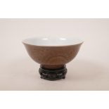 A Chinese purple glazed porcelain rice bowl and stand, with underglaze twin dragon decoration, six