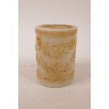 A Chinese moulded glass brush pot with raised decoration of kylin and the flaming pearl, 5" high x