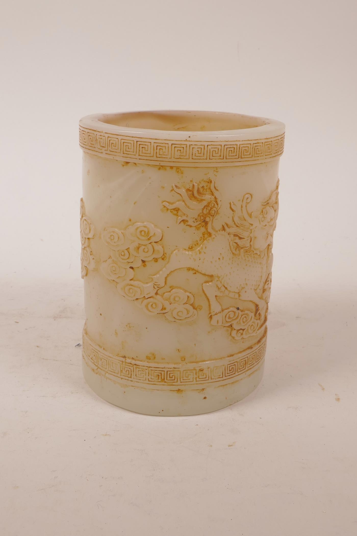 A Chinese moulded glass brush pot with raised decoration of kylin and the flaming pearl, 5" high x - Image 4 of 5